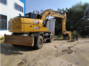 Pelle sur pneus CATERPILLAR M315