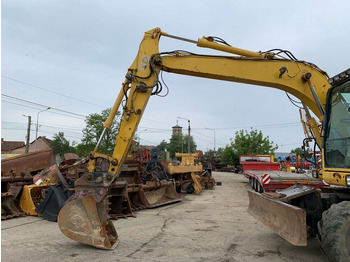 Pelle sur pneus Komatsu PW 140-7: photos 4