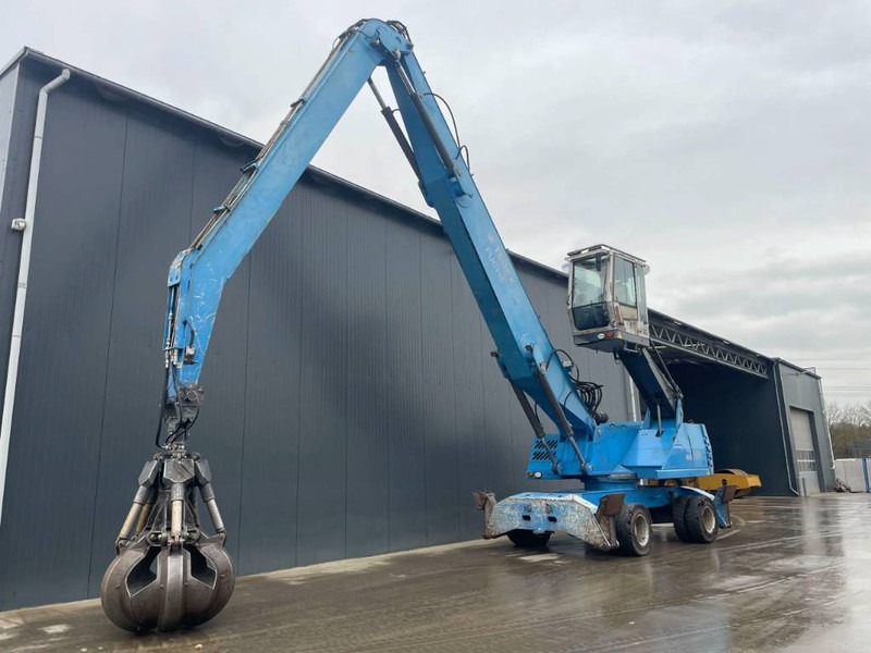 Pelle de manutention pour transport de déchets Fuchs MHL350: photos 1