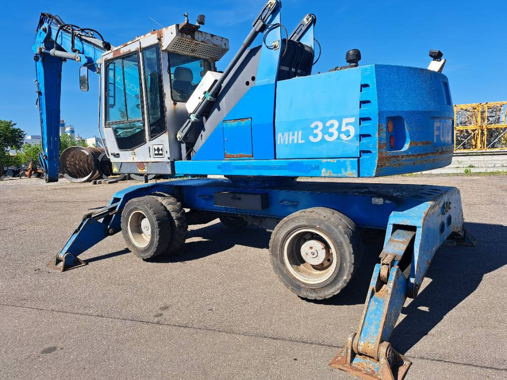 Fuchs MHL335 + Grapple + Reman Engine - Pelle de manutention: photos 1 Fuchs MHL335 + Grapple + Reman Engine - Pelle de manutention: photos 1