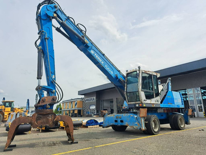 Fuchs MHL335 + Grapple + Reman Engine - Pelle de manutention: photos 1 Fuchs MHL335 + Grapple + Reman Engine - Pelle de manutention: photos 1