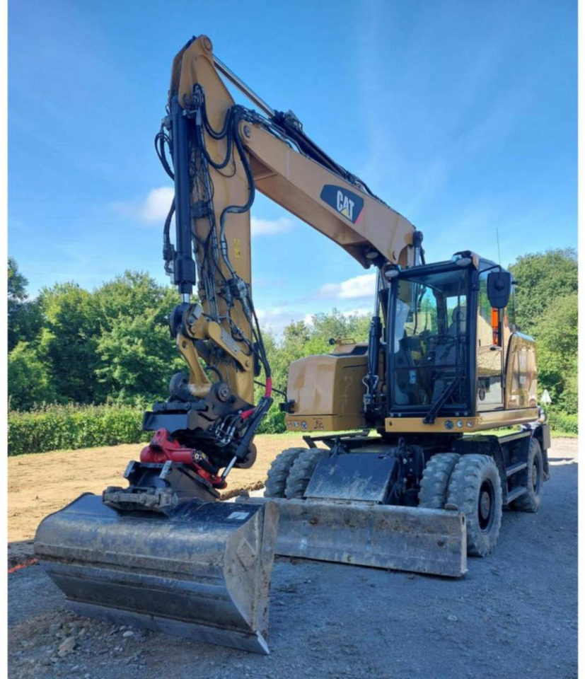 CAT M315F - Pelle sur pneus: photos 1 CAT M315F - Pelle sur pneus: photos 1