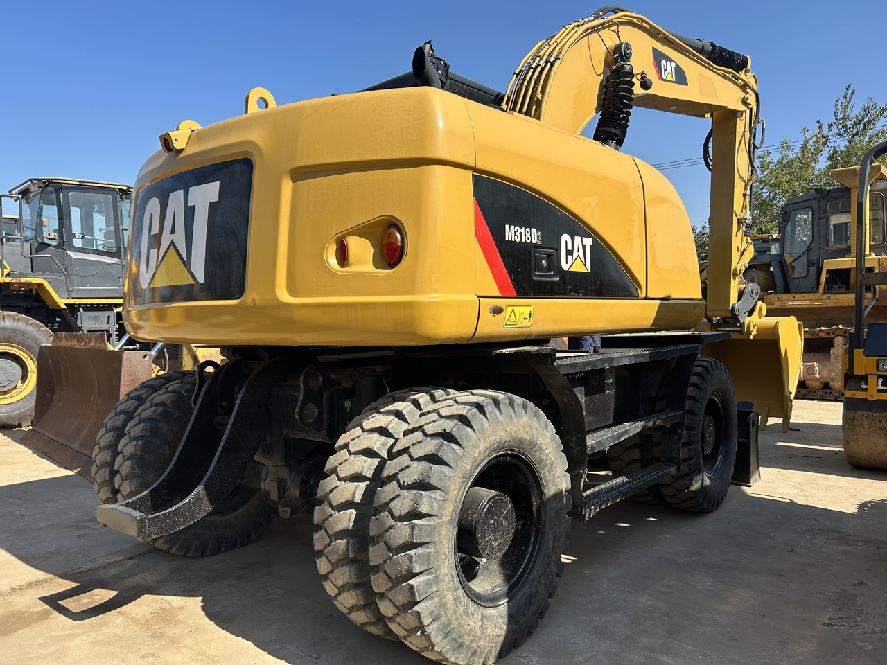 CATERPILLAR M318 - Pelle sur pneus: photos 2 CATERPILLAR M318 - Pelle sur pneus: photos 2