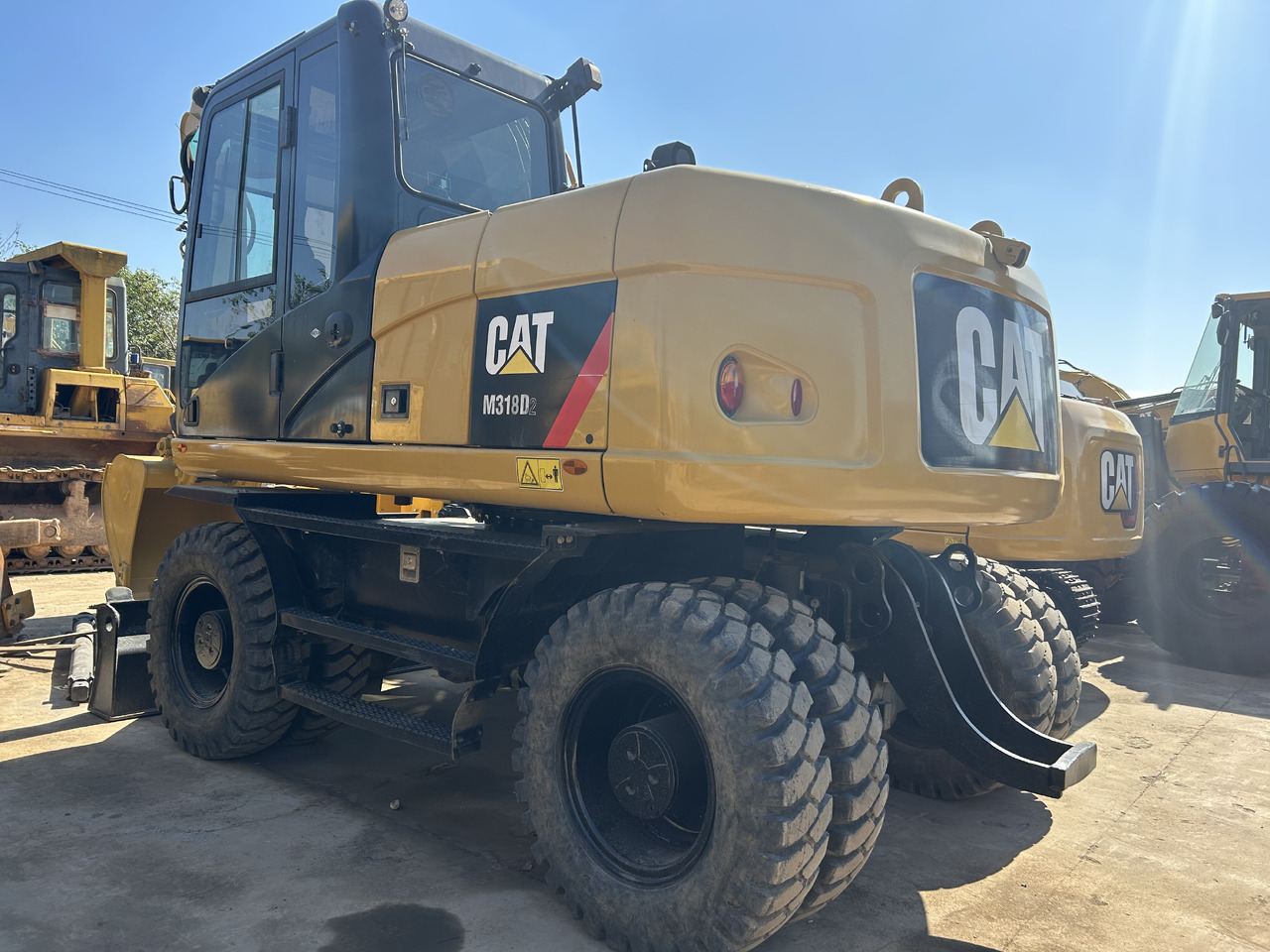 CATERPILLAR M318 - Pelle sur pneus: photos 1 CATERPILLAR M318 - Pelle sur pneus: photos 1
