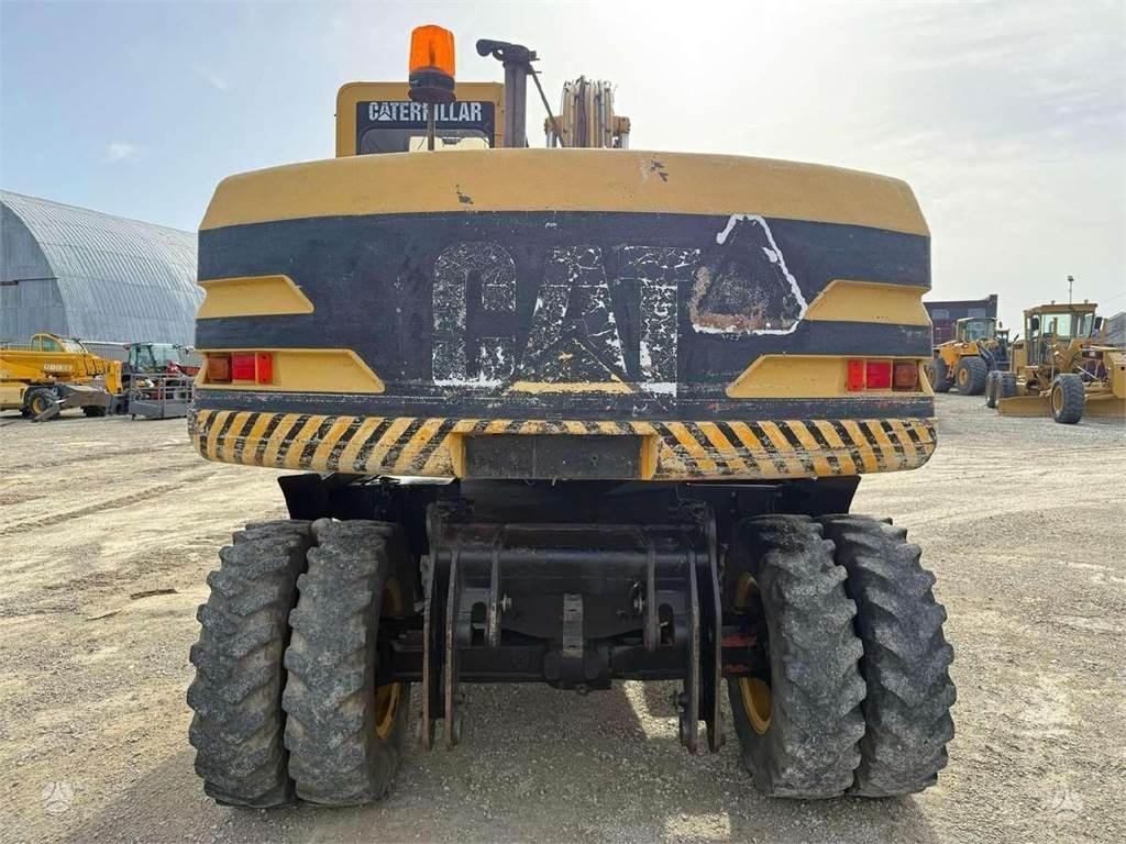 Pelle sur pneus CAT M 315: photos 6