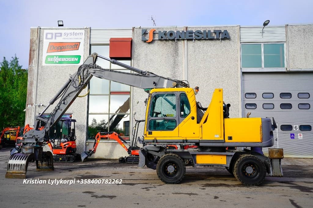 Volvo EW160B NOUSUHYTTI MATERIAALIKONE - Pelle de manutention: photos 1 Volvo EW160B NOUSUHYTTI MATERIAALIKONE - Pelle de manutention: photos 1