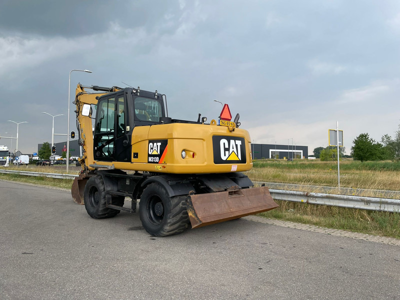 Caterpillar M313D - CE - Pelle sur pneus: photos 1 Caterpillar M313D - CE - Pelle sur pneus: photos 1