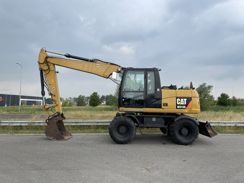 Caterpillar M313D - CE - Pelle sur pneus: photos 1 Caterpillar M313D - CE - Pelle sur pneus: photos 1