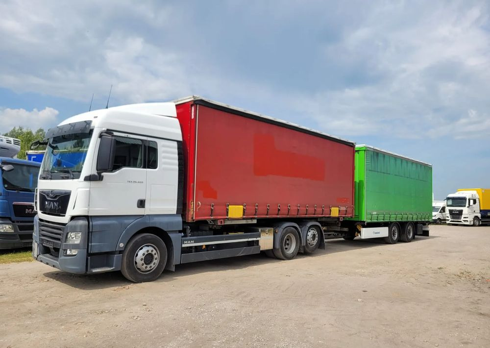 MAN - Camion à rideaux coulissants: photos 2 MAN - Camion à rideaux coulissants: photos 2
