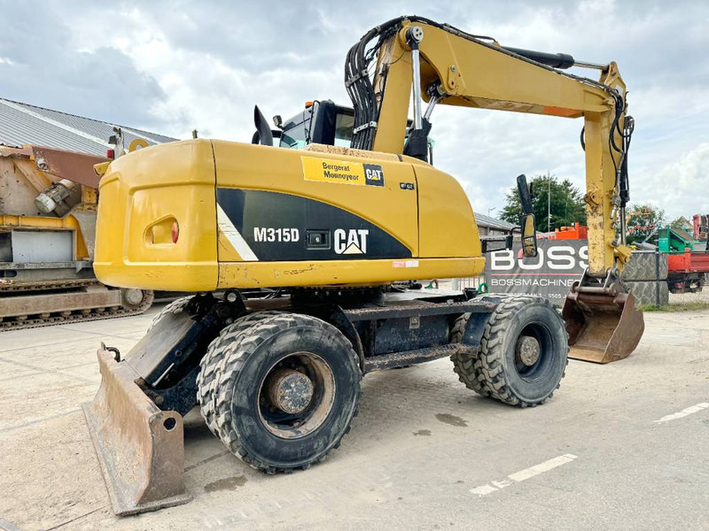 Cat M315D - Triple Boom / Quick Coupler - Pelle sur pneus: photos 5 Cat M315D - Triple Boom / Quick Coupler - Pelle sur pneus: photos 5