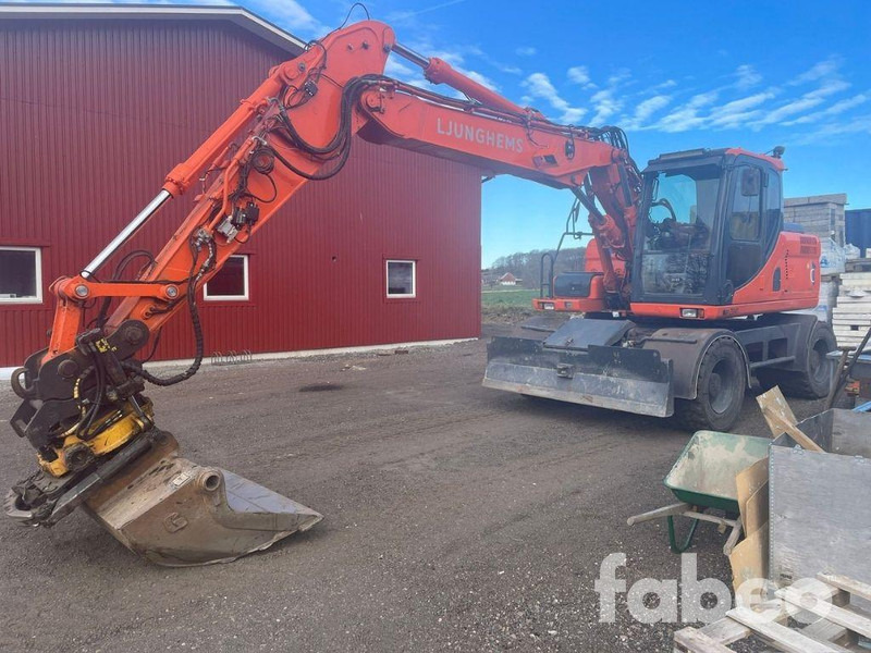 Doosan DX160W - Pelle sur pneus: photos 1 Doosan DX160W - Pelle sur pneus: photos 1