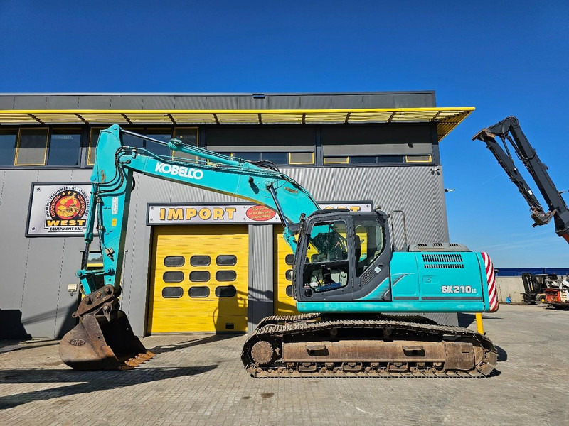 Kobelco SK210LC-9 - Pelle sur chenille: photos 1 Kobelco SK210LC-9 - Pelle sur chenille: photos 1