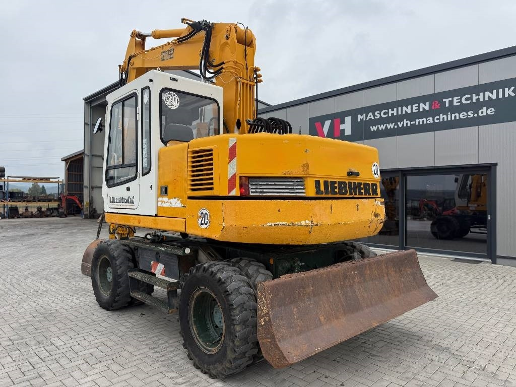 Liebherr A 312 - Pelle sur pneus: photos 3 Liebherr A 312 - Pelle sur pneus: photos 3