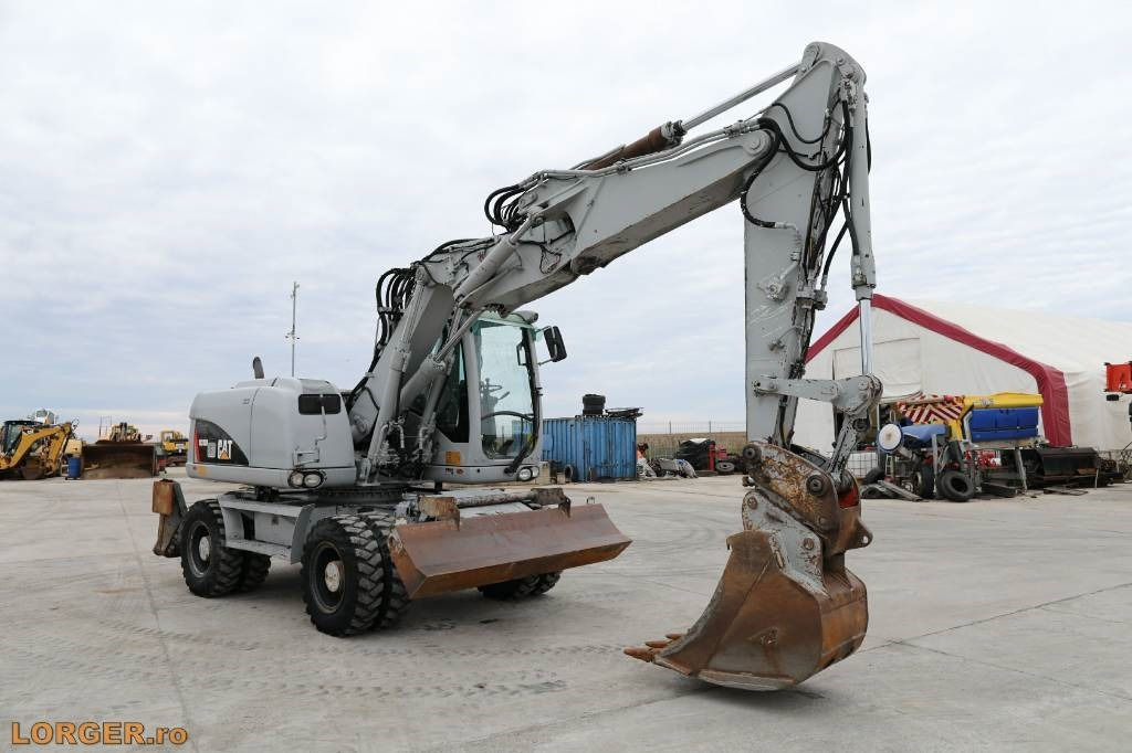 CAT M 313 D - Pelle sur pneus: photos 4 CAT M 313 D - Pelle sur pneus: photos 4