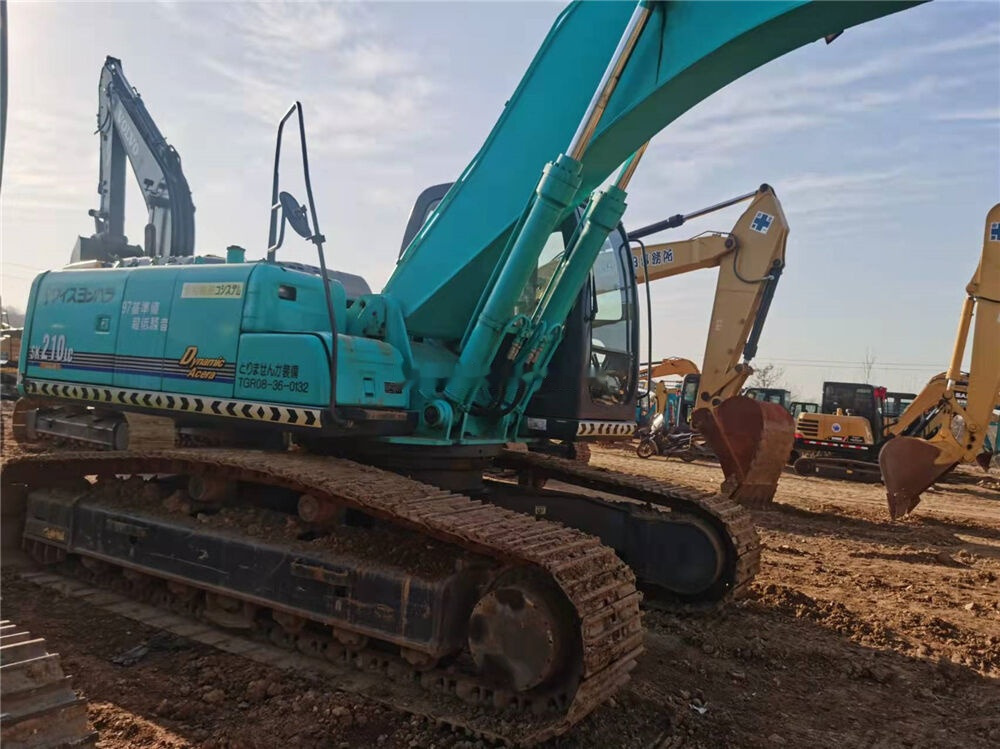 Kobelco SK210LC - Pelle sur chenille: photos 1 Kobelco SK210LC - Pelle sur chenille: photos 1