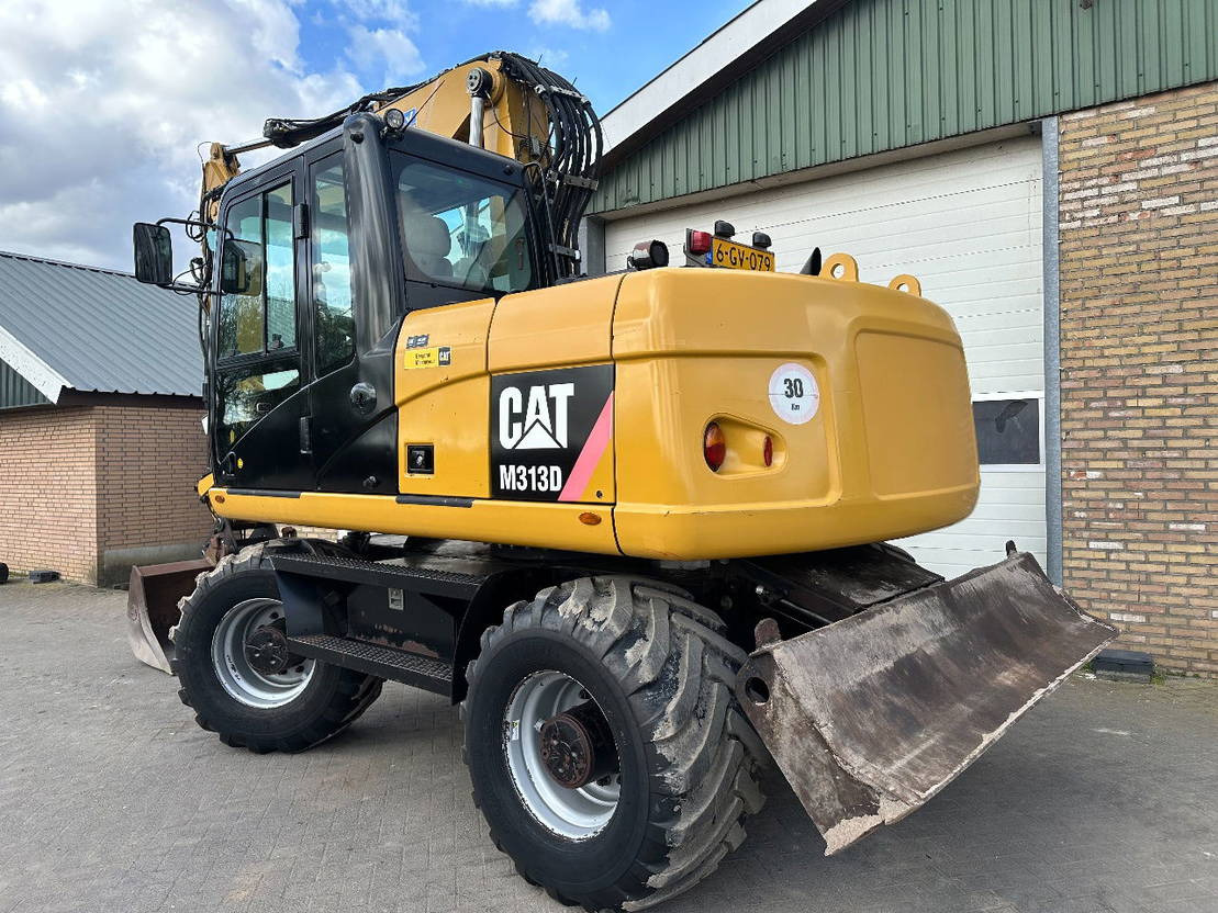 Caterpillar M313D - Pelle sur pneus: photos 3 Caterpillar M313D - Pelle sur pneus: photos 3