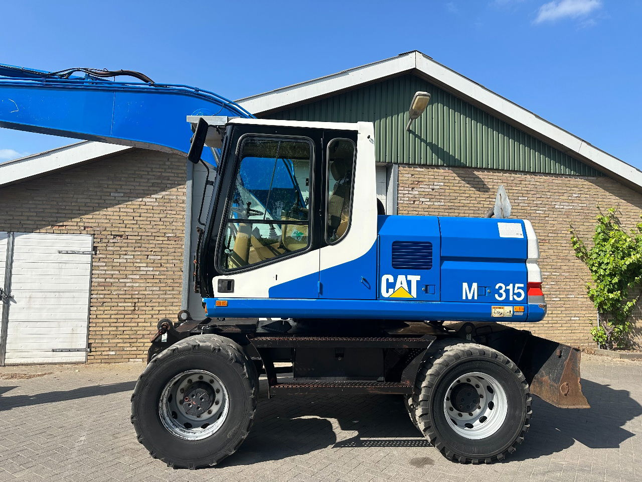 Caterpillar M315 - Pelle sur pneus: photos 2 Caterpillar M315 - Pelle sur pneus: photos 2