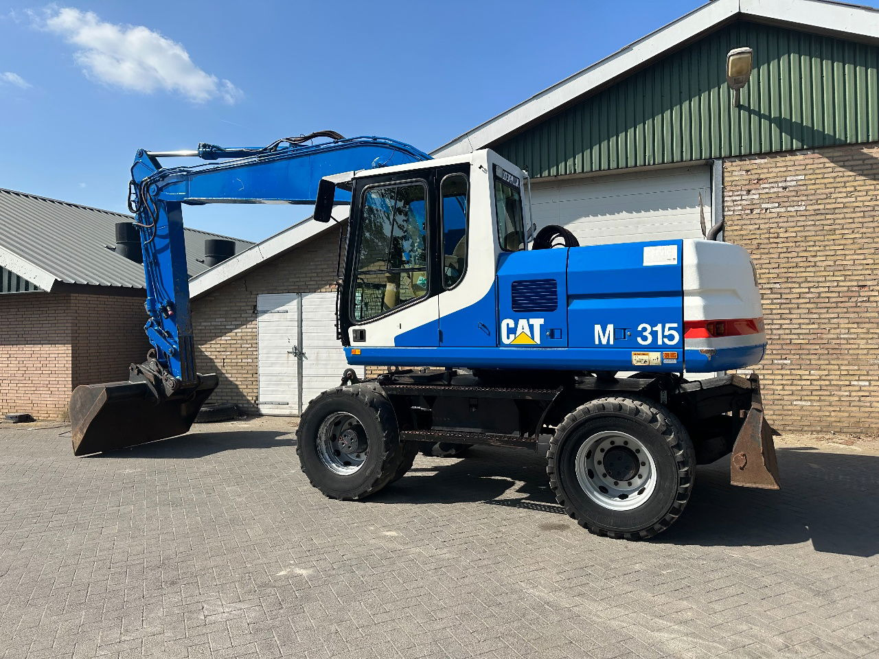 Caterpillar M315 - Pelle sur pneus: photos 4 Caterpillar M315 - Pelle sur pneus: photos 4