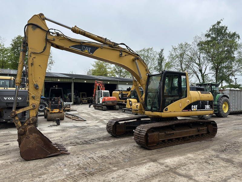 Caterpillar 318 CL (not 320CL - 325CL) - Pelle sur chenille: photos 1 Caterpillar 318 CL (not 320CL - 325CL) - Pelle sur chenille: photos 1