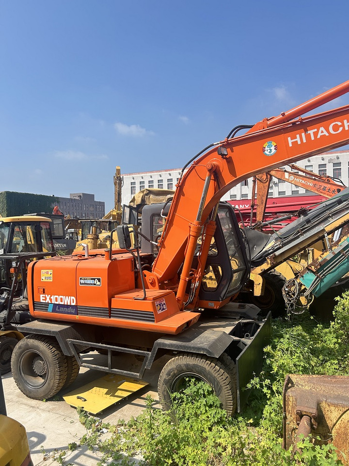 HITACHI Hitachi EX100WD wheel excavator - Pelle sur pneus: photos 1 HITACHI Hitachi EX100WD wheel excavator - Pelle sur pneus: photos 1