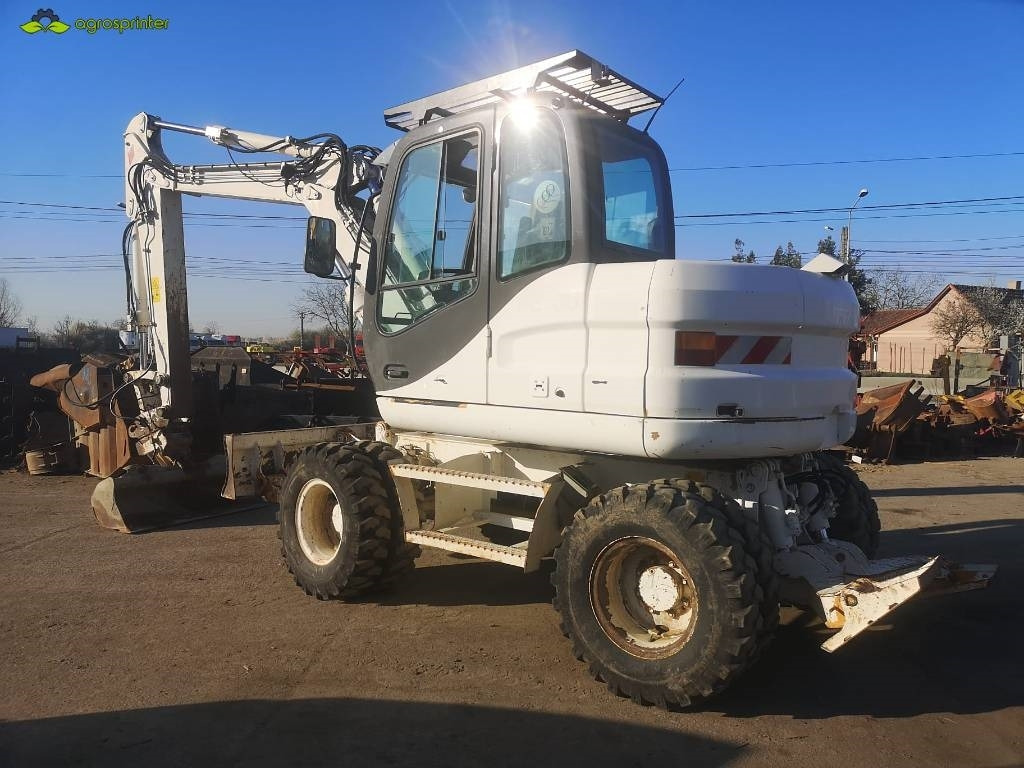 Case WX 125 - Pelle sur pneus: photos 4 Case WX 125 - Pelle sur pneus: photos 4