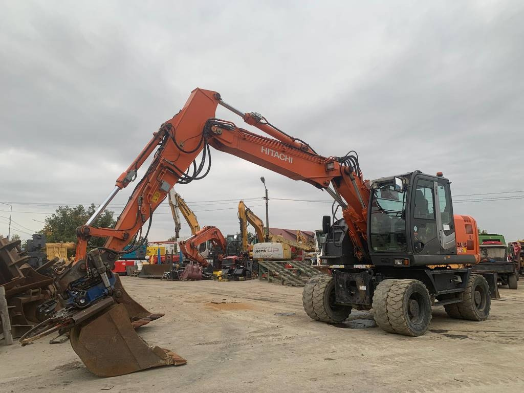 Hitachi ZX 145 W-3+SMP Rototilt - Pelle sur pneus: photos 1 Hitachi ZX 145 W-3+SMP Rototilt - Pelle sur pneus: photos 1