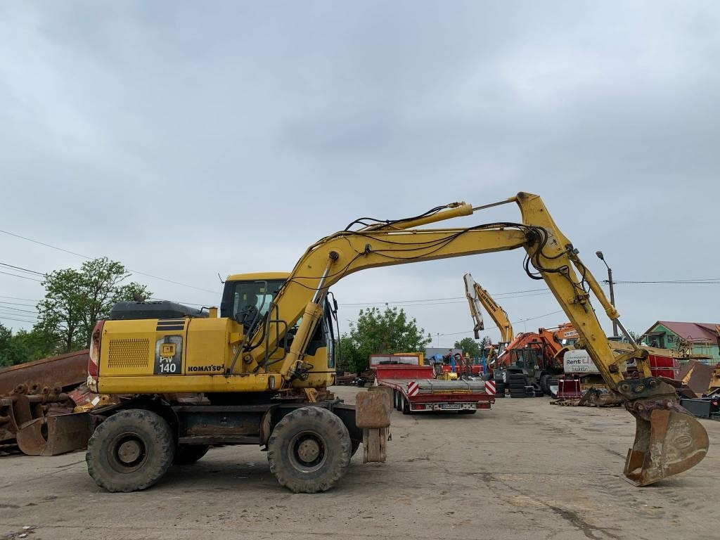 Pelle sur pneus Komatsu PW 140-7: photos 6
