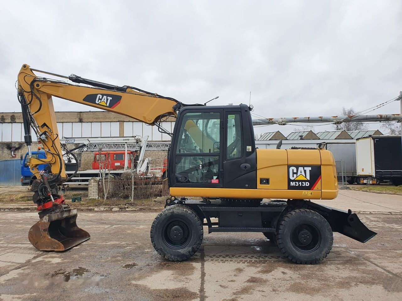 Caterpillar M 313 D Tiltrotator - Pelle sur pneus: photos 1 Caterpillar M 313 D Tiltrotator - Pelle sur pneus: photos 1