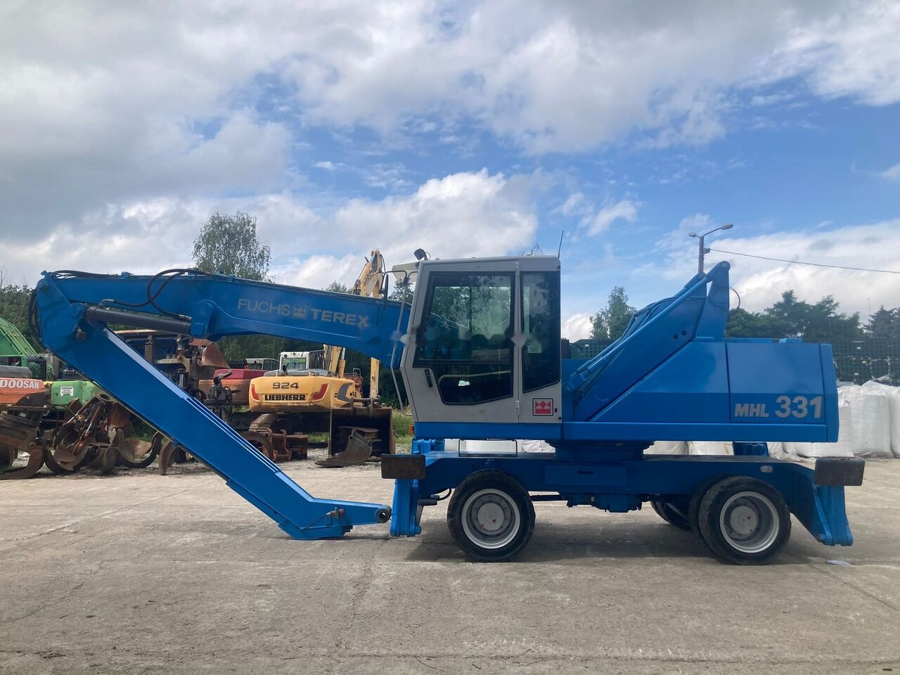 Fuchs MHL 331 C with Generator - Pelle de manutention: photos 1 Fuchs MHL 331 C with Generator - Pelle de manutention: photos 1