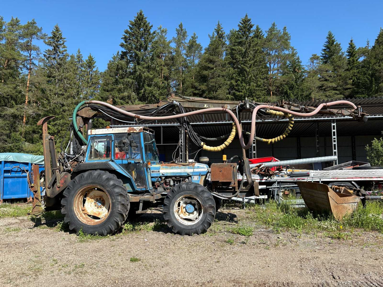 Rock drill Doofor DF530S and Tractor Ford New Holland 5610 - Foreuse: photos 1 Rock drill Doofor DF530S and Tractor Ford New Holland 5610 - Foreuse: photos 1