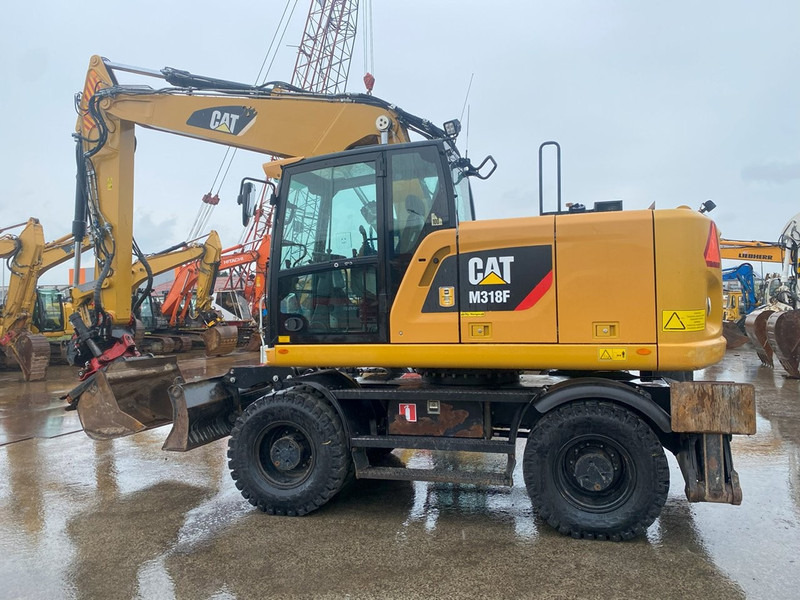 Caterpillar M318F NVT - Pelle sur pneus: photos 1 Caterpillar M318F NVT - Pelle sur pneus: photos 1