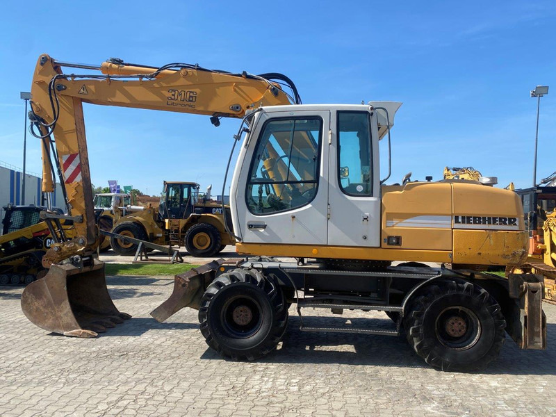 Liebherr A316 Litronic A 316 litronic - Pelle sur pneus: photos 2 Liebherr A316 Litronic A 316 litronic - Pelle sur pneus: photos 2