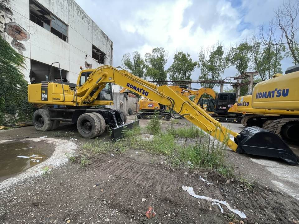 Pelle sur pneus Komatsu PC160LC: photos 20