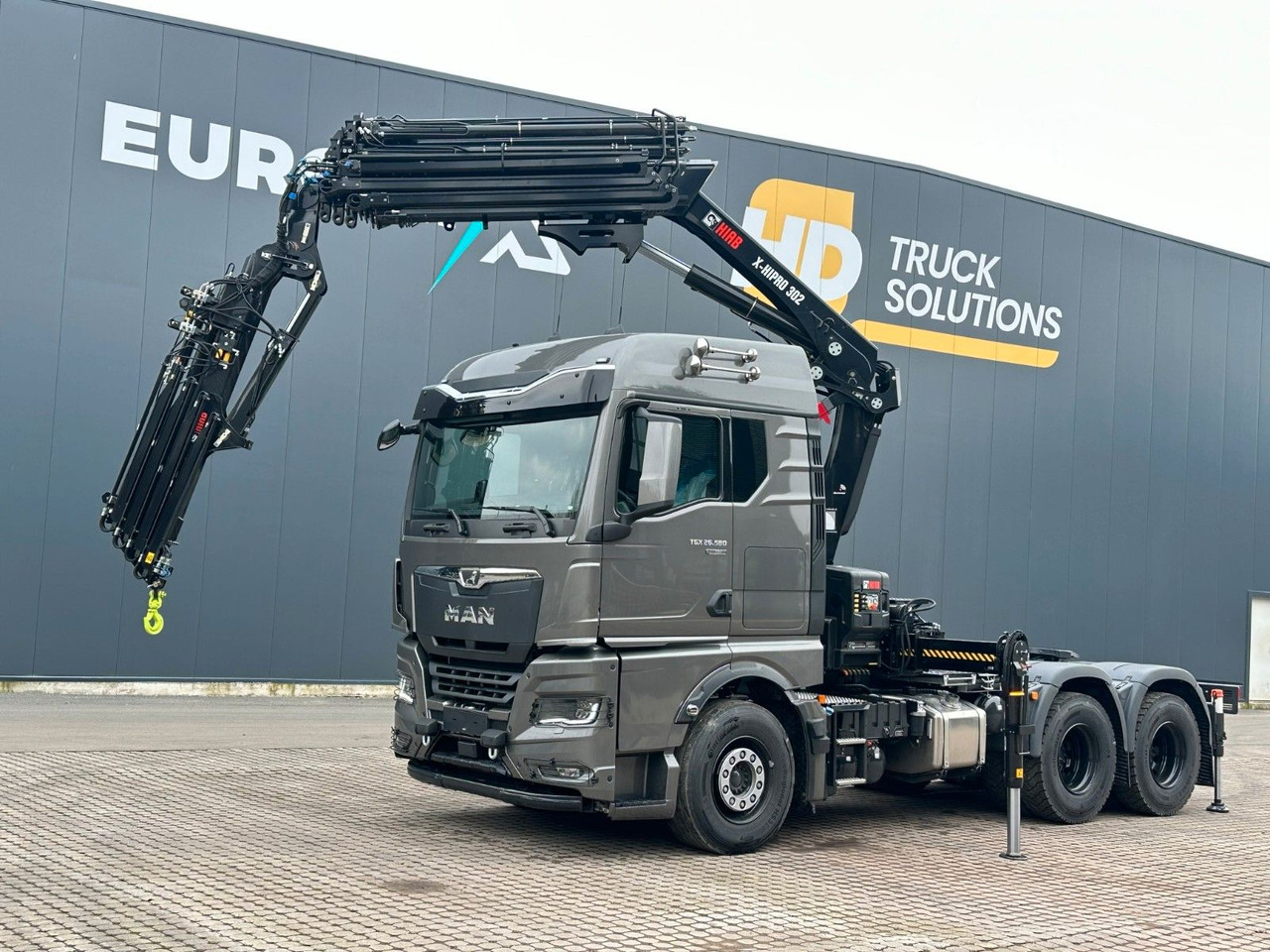 MAN TGX 26.580 6x4 Kran Hiab 302-6 + Jib-4 - Tracteur routier: photos 1 MAN TGX 26.580 6x4 Kran Hiab 302-6 + Jib-4 - Tracteur routier: photos 1