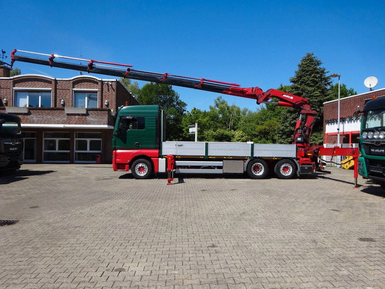MAN 26.480 TGX + MKG HLK531 Kran +Lift-Lenkachse - Camion plateau, Camion grue: photos 1 MAN 26.480 TGX + MKG HLK531 Kran +Lift-Lenkachse - Camion plateau, Camion grue: photos 1