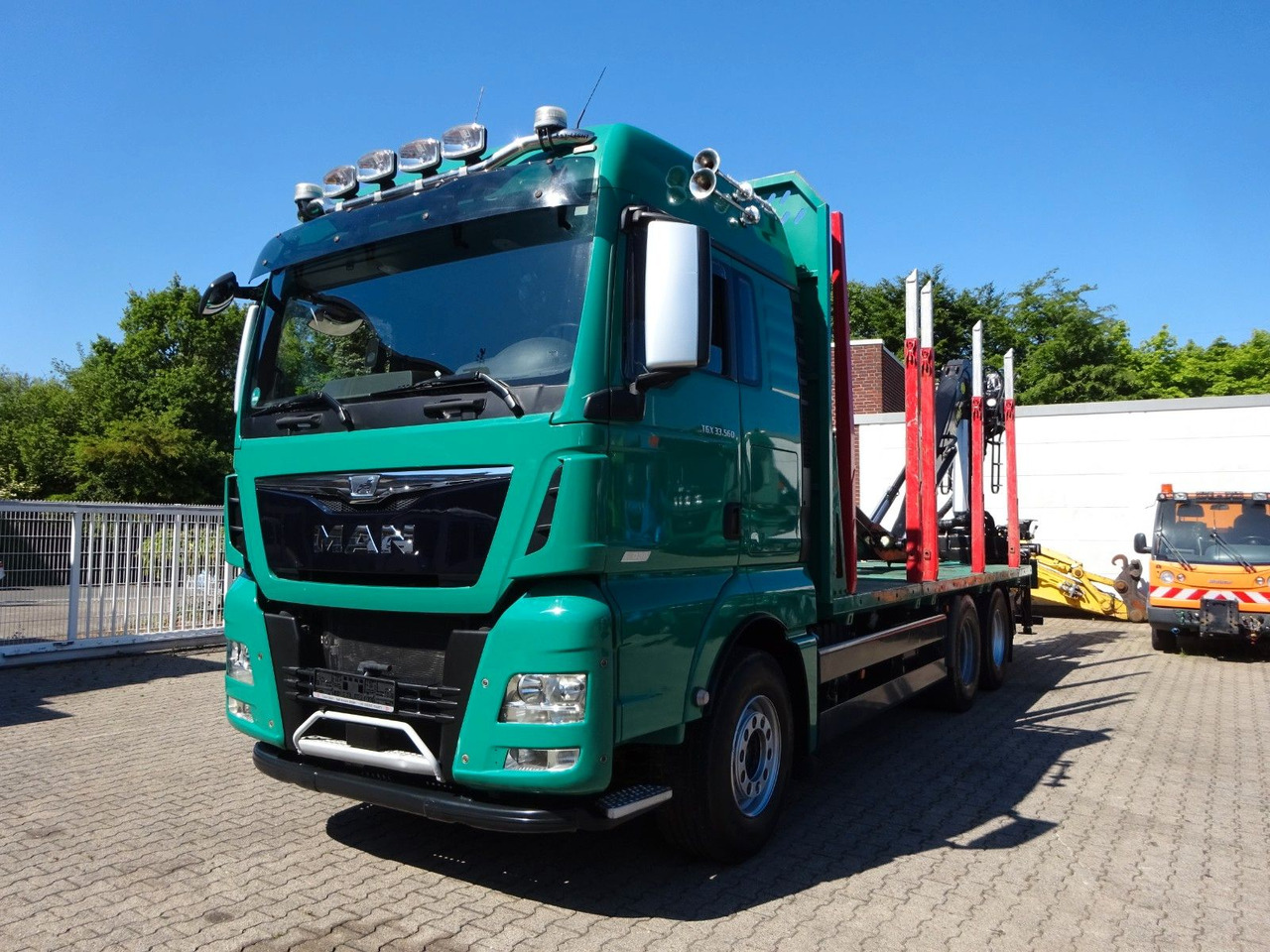 MAN 33.560 TGX mit TAJFUN L150Z Holzladekran 6x4 - Camion grumier, Camion grue: photos 1 MAN 33.560 TGX mit TAJFUN L150Z Holzladekran 6x4 - Camion grumier, Camion grue: photos 1