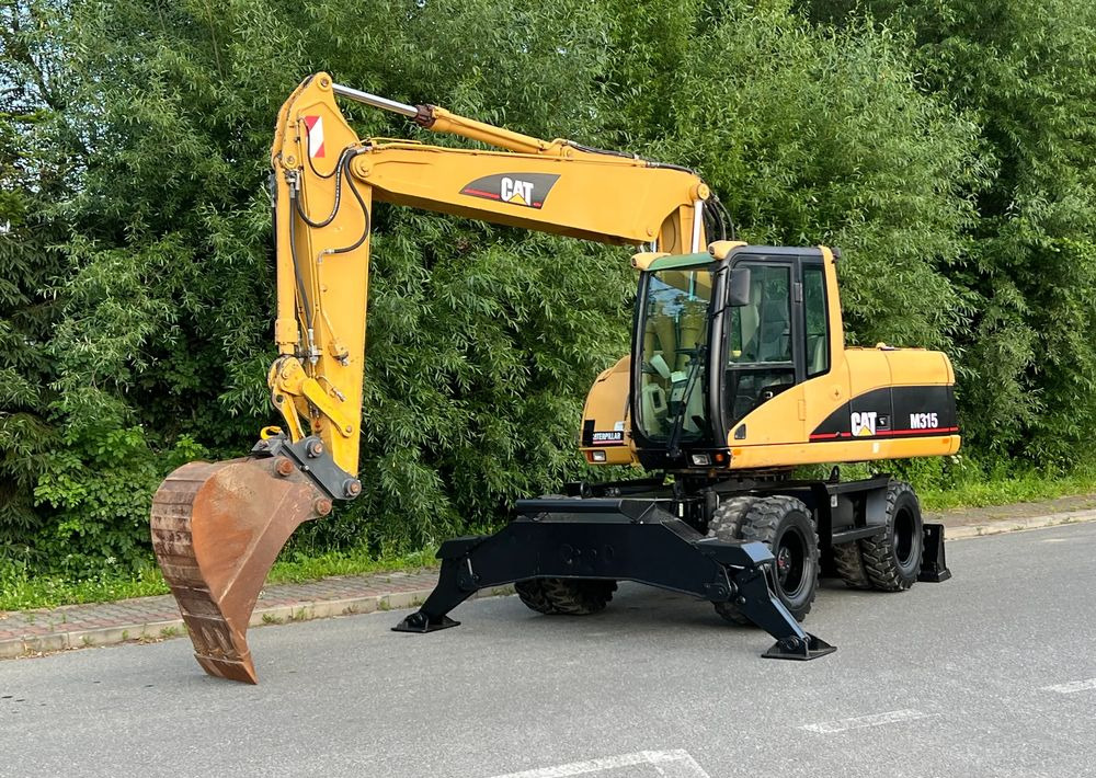 Caterpillar CAT M315C CATERPILLAR SPROWADZONY Bardzo Dobry Stan - Pelle sur pneus: photos 1 Caterpillar CAT M315C CATERPILLAR SPROWADZONY Bardzo Dobry Stan - Pelle sur pneus: photos 1