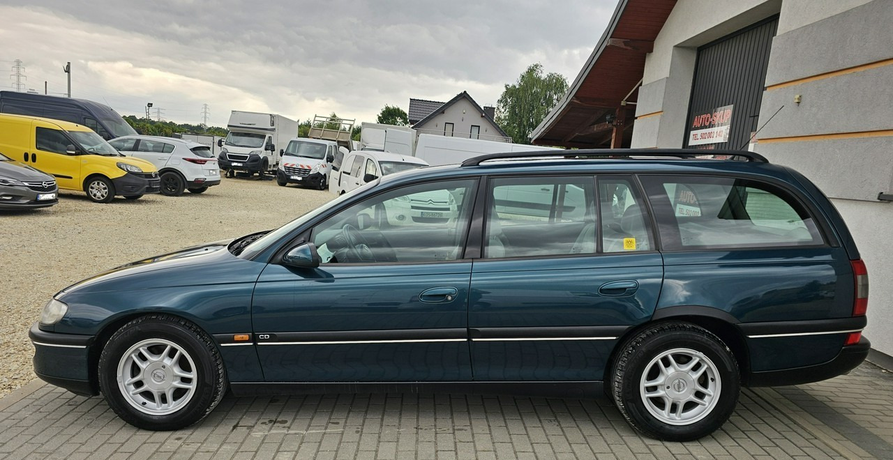 Opel Omega B 2,5 v6 *automat* napęd tył *welury* - Voiture break: photos 4 Opel Omega B 2,5 v6 *automat* napęd tył *welury* - Voiture break: photos 4