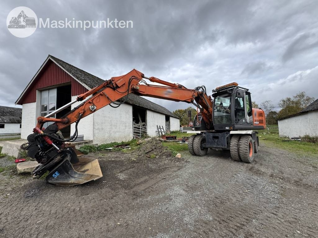 Hitachi ZX 140 W-3 - Pelle sur pneus: photos 1 Hitachi ZX 140 W-3 - Pelle sur pneus: photos 1