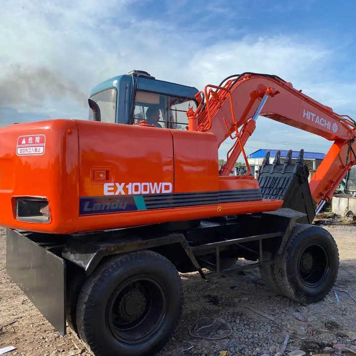 Used Hitachi Ex100WD Wheel Excavator for Sale Japan Made Hitachi Ex100wd Wheeled Excavator for Sale - Pelle sur pneus: photos 1 Used Hitachi Ex100WD Wheel Excavator for Sale Japan Made Hitachi Ex100wd Wheeled Excavator for Sale - Pelle sur pneus: photos 1