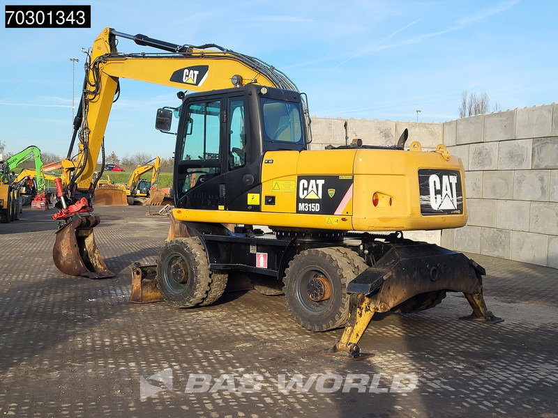 Caterpillar M315 D OUTRIGGERS + BLADE - Pelle sur pneus: photos 3 Caterpillar M315 D OUTRIGGERS + BLADE - Pelle sur pneus: photos 3