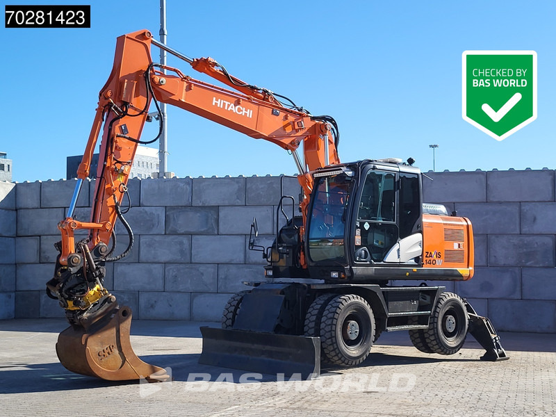Hitachi ZX140W -5 OUTRIGGERS + BLADE - Pelle sur pneus: photos 1 Hitachi ZX140W -5 OUTRIGGERS + BLADE - Pelle sur pneus: photos 1