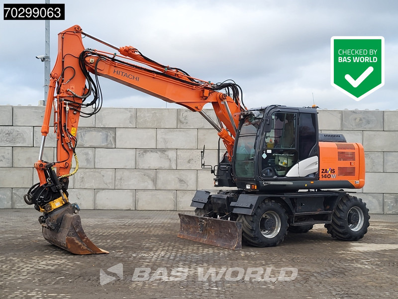 Hitachi ZX140W -5B Engcon Tiltrotator - Pelle sur pneus: photos 1 Hitachi ZX140W -5B Engcon Tiltrotator - Pelle sur pneus: photos 1