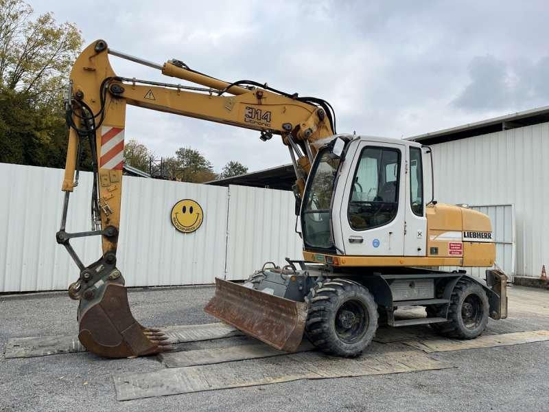 Liebherr A314 Litronic - Pelle sur pneus: photos 1 Liebherr A314 Litronic - Pelle sur pneus: photos 1