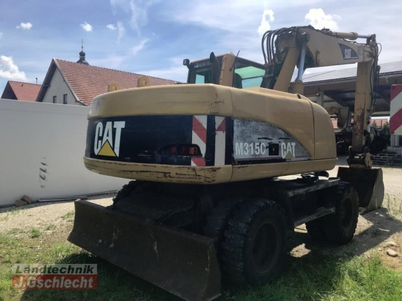 Pelle sur pneus Caterpillar m 315c: photos 8