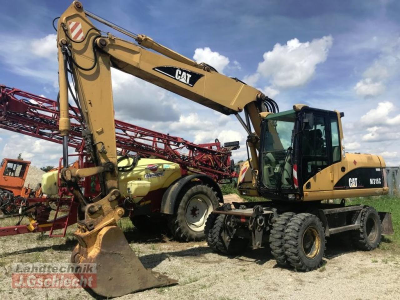 Pelle sur pneus Caterpillar m 315c: photos 9