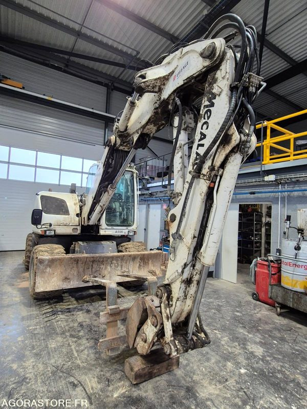 PELLE A PNEUS - MECALAC 714 MW NON ROULANTE - 2016 / 11695 HEURES (MA556) - Pelle: photos 1 PELLE A PNEUS - MECALAC 714 MW NON ROULANTE - 2016 / 11695 HEURES (MA556) - Pelle: photos 1