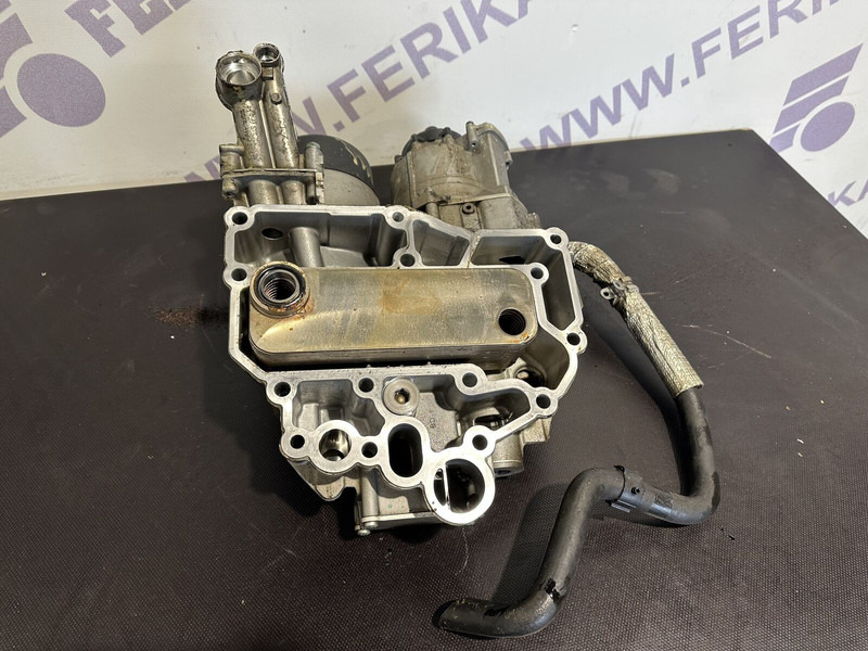 MAN oil filter housing with coolant - Moteur et pièces pour Camion: photos 1 MAN oil filter housing with coolant - Moteur et pièces pour Camion: photos 1