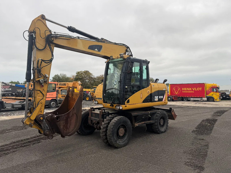 Caterpillar M313D 7212 HOURS - Pelle sur pneus: photos 1 Caterpillar M313D 7212 HOURS - Pelle sur pneus: photos 1