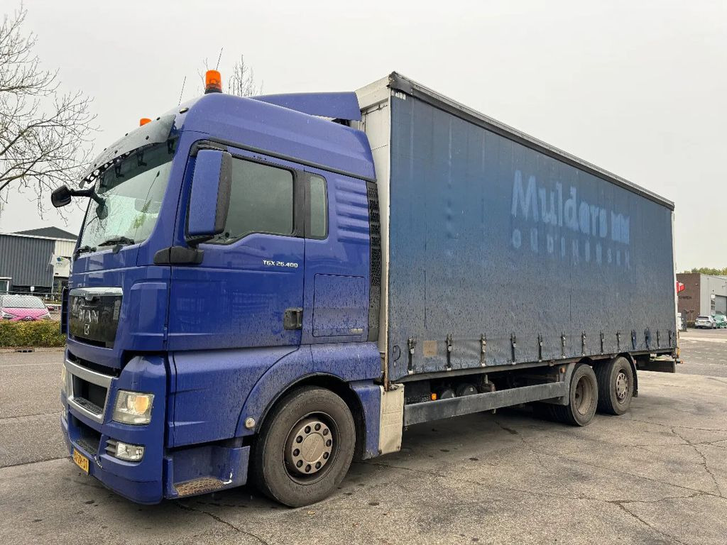 MAN TGX 26.400 6X2 - EURO 4 + LIFT + STEERING AXLE + - Camion à rideaux coulissants: photos 1 MAN TGX 26.400 6X2 - EURO 4 + LIFT + STEERING AXLE + - Camion à rideaux coulissants: photos 1